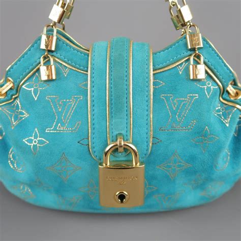 louis vuitton clutch with turquoise clasp